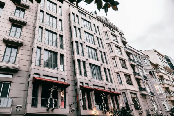 From below of contemporary residential building decorated with figures located on street of Istanbul